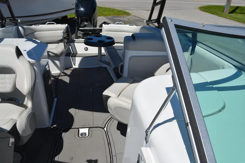Slide: The Image of 2022 Hurricane SunDeck 2690 OB interior with seating and table, showcasing spacious design. - 9