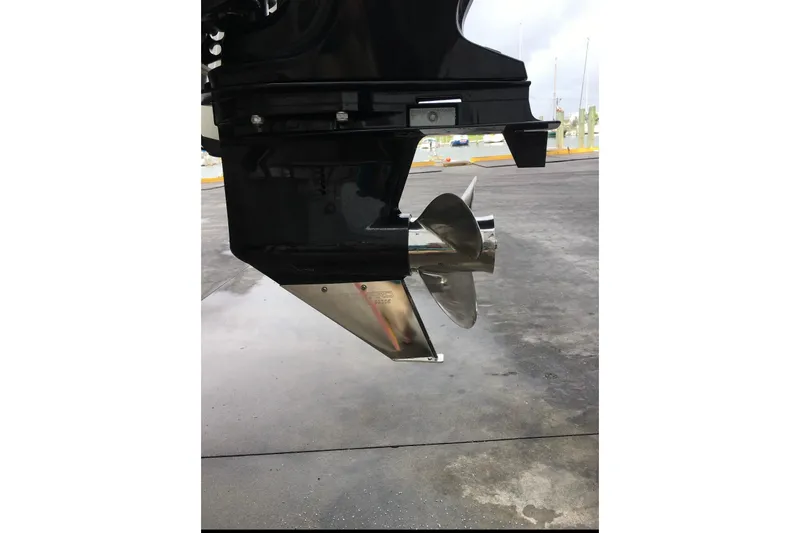 Slide: The Image of 2016 Mako 18 LTS boat propeller and lower unit on a concrete surface. - 5