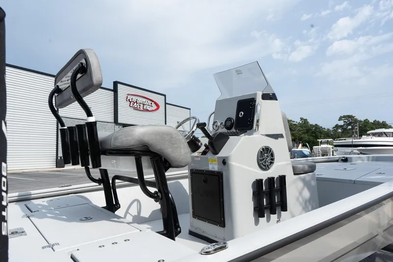Slide: The Image of 2025 Avid 19 FSX boat interior with steering console and seating. - 14
