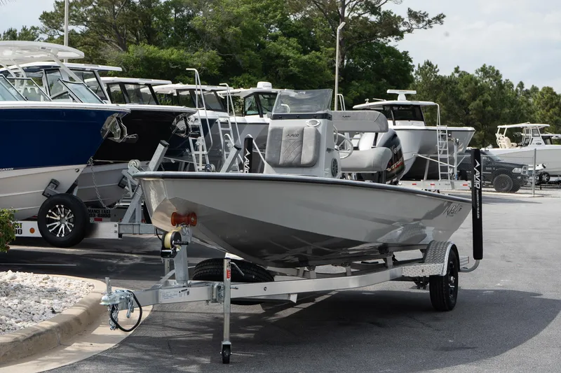 Slide: The Image of 2025 Avid 19 FSX boat on trailer in marina parking lot. - 3