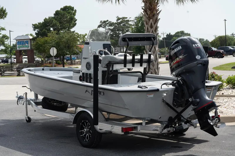 Slide: The Image of 2025 Avid 19 FSX boat on trailer with Yamaha outboard motor, parked outdoors. - 5