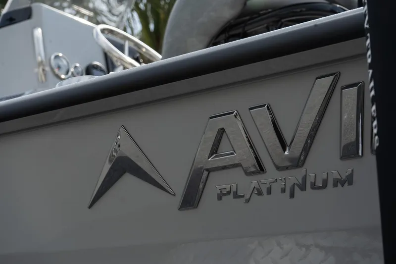 Slide: The Image of 2025 Avid 19 FSX boat with "AVI Platinum" logo detail. - 6