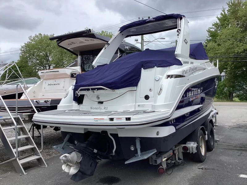 Slide: The Image of 2022 Monterey 295 Sport Yacht on trailer, covered, parked outdoors. - 29