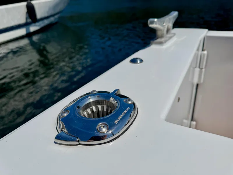 Slide: The Image of 2020 Coastal Craft 33 Express boat detail with stainless steel fitting and cleat. - 10