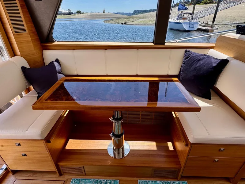 Slide: The Image of Luxurious interior of 2020 Coastal Craft 33 Express yacht with elegant seating and table. - 19