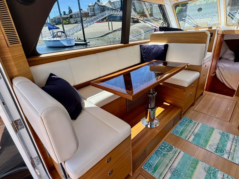 Slide: The Image of Interior of 2020 Coastal Craft 33 Express yacht with elegant seating and dining area. - 20