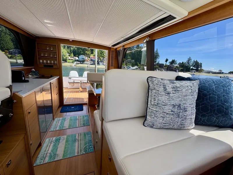 Slide: The Image of Interior of 2020 Coastal Craft 33 Express yacht with elegant seating and scenic view. - 23