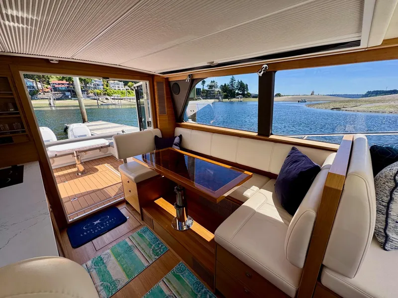 Slide: The Image of Interior of 2020 Coastal Craft 33 Express yacht with elegant seating and scenic water view. - 25