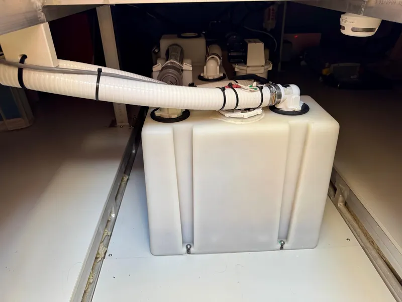 Slide: The Image of Engine compartment of 2020 Coastal Craft 33 Express with visible tank and hoses. - 35