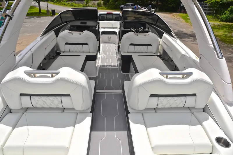 Slide: The Image of 2022 Regal LS4 boat interior with luxurious white seating and modern design. - 21