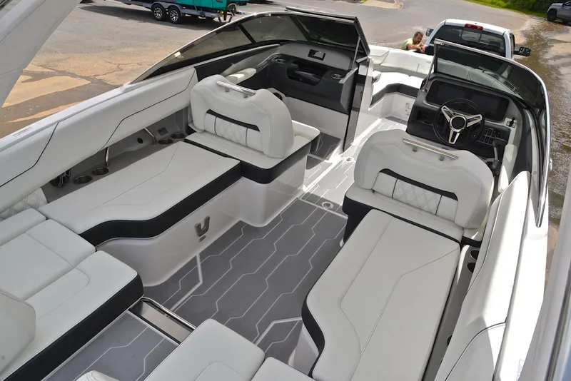 Slide: The Image of 2022 Regal LS4 boat interior with luxurious white seating and modern dashboard design. - 22