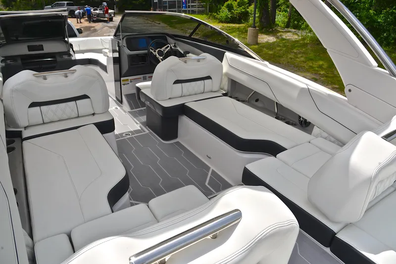 Slide: The Image of Luxurious 2022 Regal LS4 boat interior with white seating and modern design. - 23