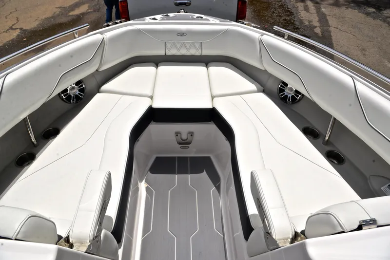 Slide: The Image of 2022 Regal LS4 boat interior with white seating and modern design. - 25