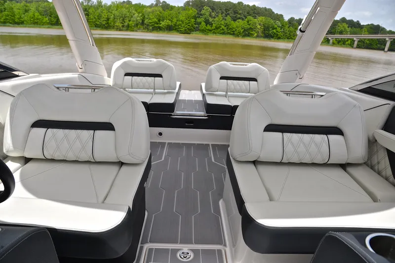 Slide: The Image of Luxurious interior of 2022 Regal LS4 boat with elegant seating and river view. - 26