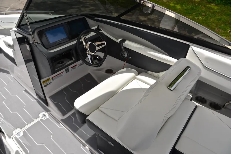 Slide: The Image of 2022 Regal LS4 boat interior with modern dashboard and white seating. - 28