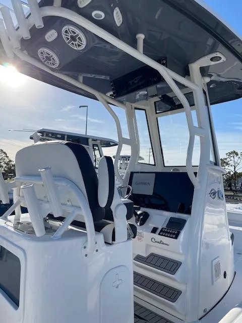 Slide: The Image of 2025 Tidewater 2500 Carolina Bay boat interior with advanced navigation and seating features. - 11