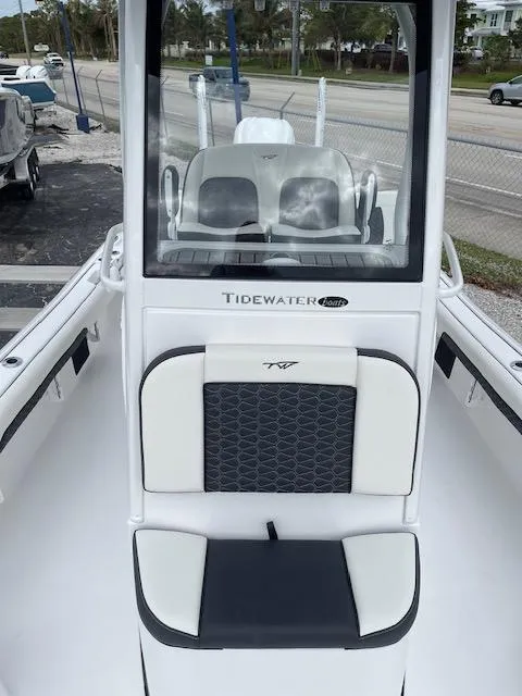 Slide: The Image of 2025 Tidewater 2500 Carolina Bay boat interior with seating and console. - 20