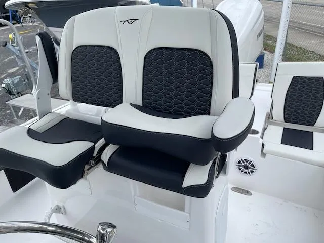 Slide: The Image of 2025 Tidewater 2500 Carolina Bay boat seats with black and white upholstery. - 25
