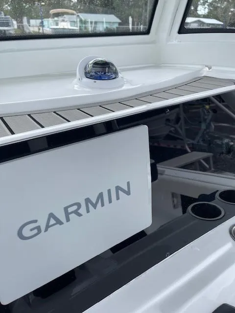 Slide: The Image of 2025 Tidewater 2500 Carolina Bay boat with Garmin navigation system. - 26