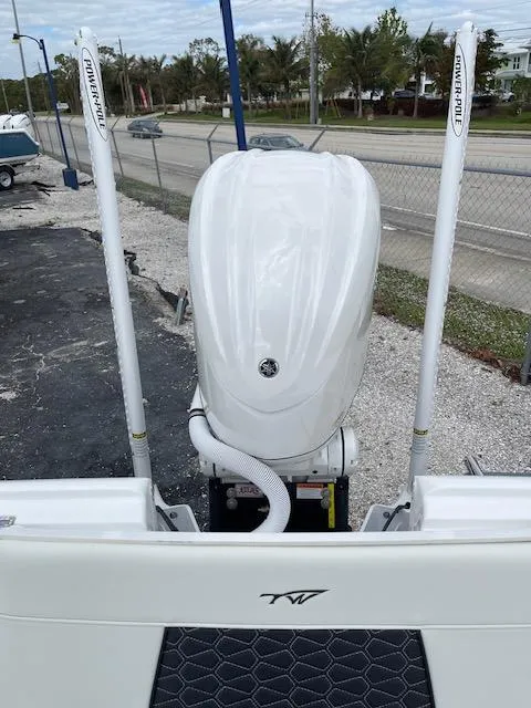 Slide: The Image of 2025 Tidewater 2500 Carolina Bay boat with dual Power-Pole anchors, rear view. - 27