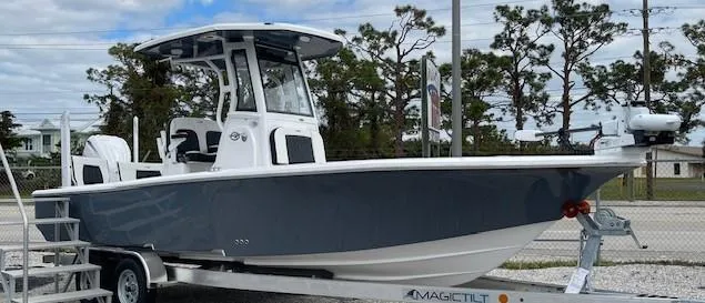Slide: The Image of 2025 Tidewater 2500 Carolina Bay boat on trailer, parked outdoors. - 4