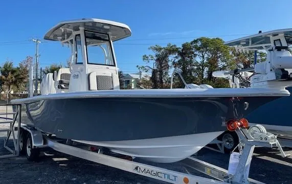 Slide: The Image of 2025 Tidewater 2500 Carolina Bay boat on trailer, parked outdoors. - 7