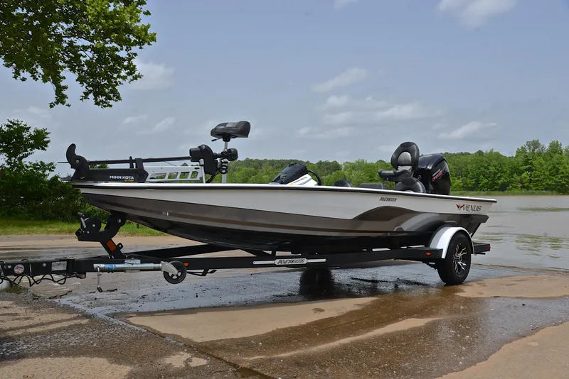 Slide: The Image of 2020 Vexus AVX1880 boat on trailer by a lake, ready for launch. - 10