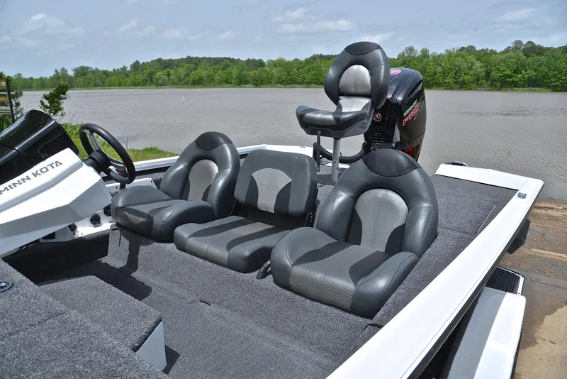 Slide: The Image of 2020 Vexus AVX1880 boat interior with seating, near a riverbank. - 18