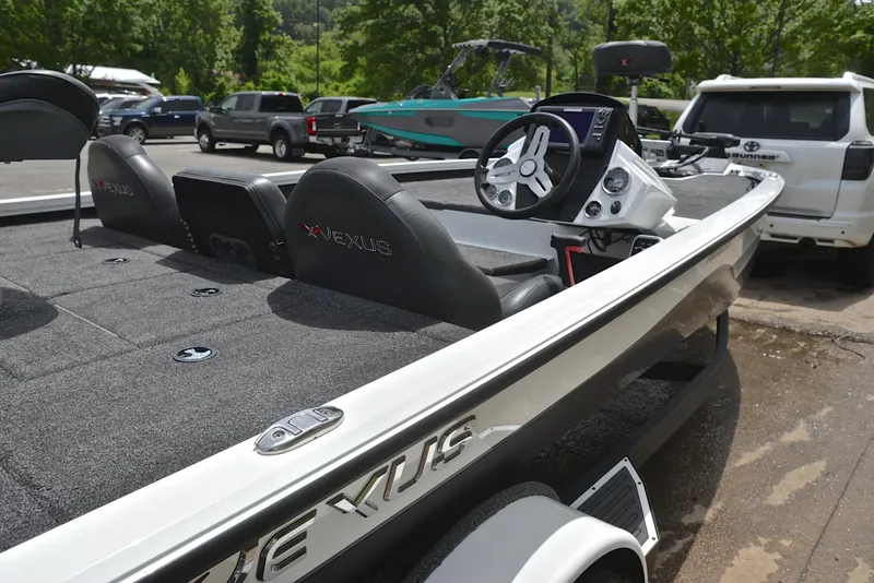 Slide: The Image of 2020 Vexus AVX1880 boat parked, featuring sleek design and modern dashboard. - 19