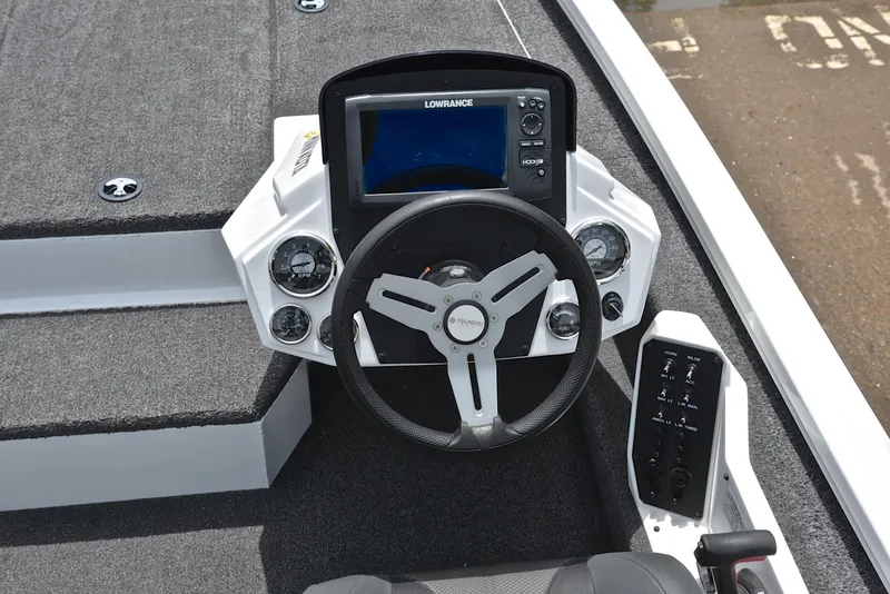 Slide: The Image of 2020 Vexus AVX1880 boat dashboard with steering wheel and Lowrance display. - 24