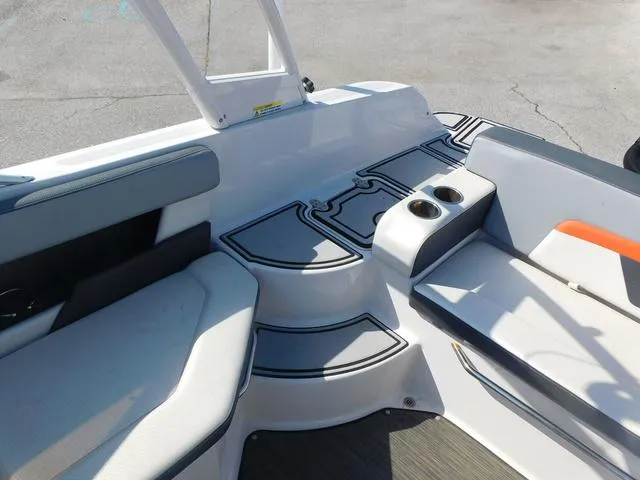 Slide: The Image of 2018 Four Winns HD 200 OB RS boat interior with seating and cup holders. - 12