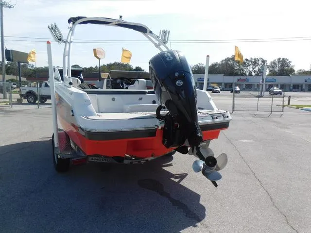 Slide: The Image of 2018 Four Winns HD 200 OB RS boat with outboard motor, parked in a lot. - 4