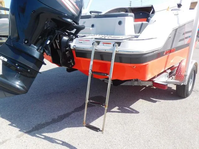 Slide: The Image of 2018 Four Winns HD 200 OB RS boat with ladder and outboard motor. - 5