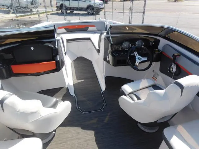 Slide: The Image of 2018 Four Winns HD 200 OB RS boat interior with modern seating and dashboard. - 6