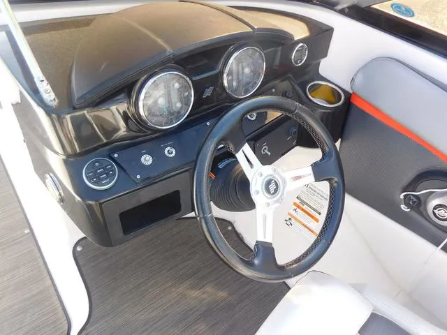 Slide: The Image of 2018 Four Winns HD 200 OB RS boat dashboard with steering wheel and gauges. - 8