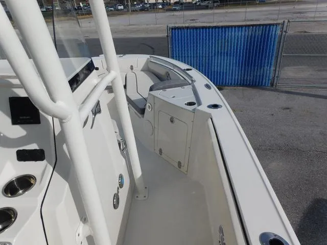 Slide: The Image of 2024 Stingray 216CC boat interior, featuring sleek white design and spacious seating area. - 20