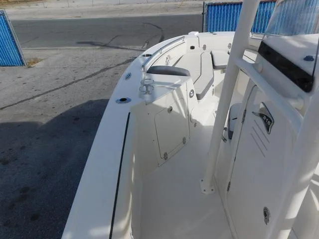 Slide: The Image of 2024 Stingray 216CC boat interior with seating and storage compartments. - 21