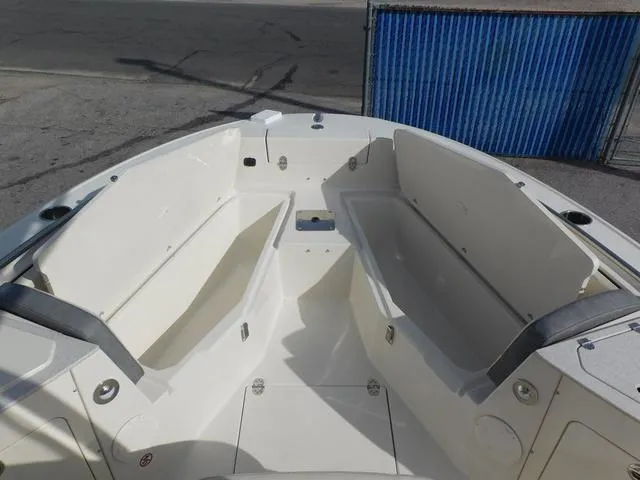 Slide: The Image of 2024 Stingray 216CC boat interior with spacious seating and storage compartments. - 29