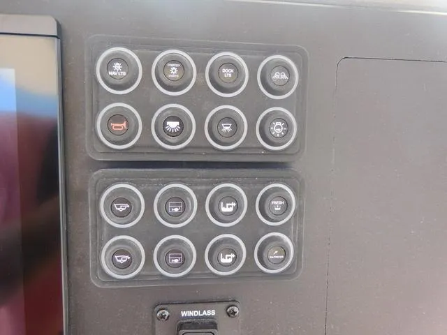 Slide: The Image of Control panel of 2024 Stingray 253CC boat with labeled buttons and windlass switch. - 28