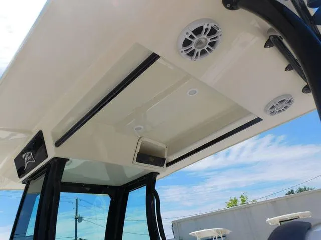 Slide: The Image of 2024 Stingray 253CC boat interior roof with speakers and lighting, showcasing modern design. - 30