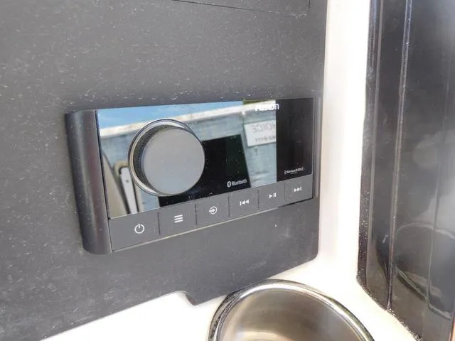 Slide: The Image of 2024 Stingray 253CC boat audio control panel with Bluetooth connectivity. - 34