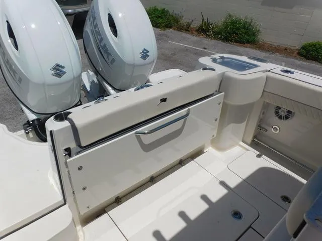 Slide: The Image of 2024 Stingray 253CC boat with dual Suzuki outboard motors, featuring a spacious deck layout. - 42