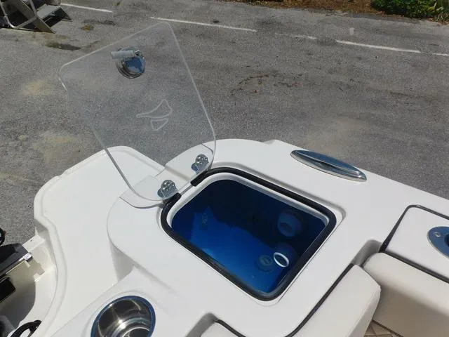 Slide: The Image of 2024 Stingray 253CC boat livewell with open lid, showcasing sleek design and functionality. - 45