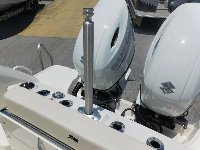 Slide: The Image of 2024 Stingray 253CC boat with dual Suzuki outboard motors, rear view. - 47