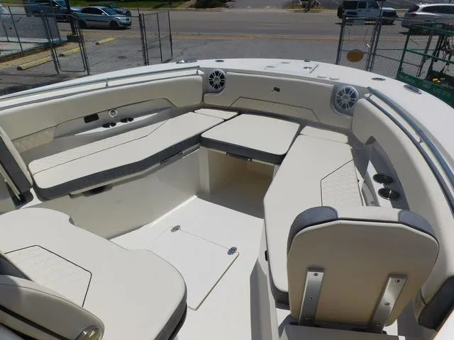 Slide: The Image of 2024 Stingray 253CC boat interior with spacious seating and modern design. - 8