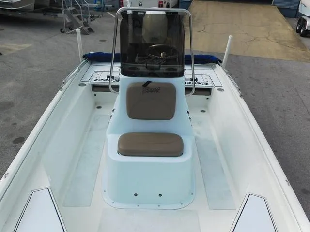 Slide: The Image of 2018 Excel Boats Bay Pro 220, center console, white interior, docked on pavement. - 11