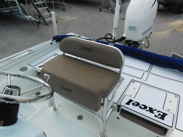 Slide: The Image of 2018 Excel Boats Bay Pro 220 interior with seating and steering wheel. - 15