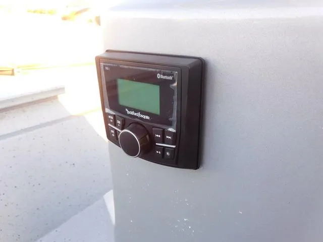 Slide: The Image of 2021 Xpress Boats H190 Bluetooth stereo system on a gray panel. - 11