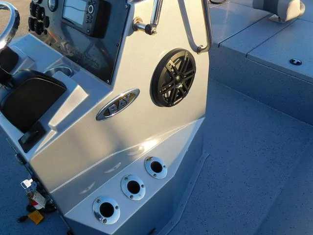 Slide: The Image of 2021 Xpress Boats H190 console with controls and speaker, featuring modern design elements. - 12