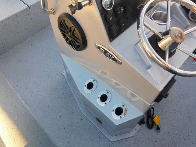 Slide: The Image of 2021 Xpress Boats H190 console with steering wheel and control panel. - 13